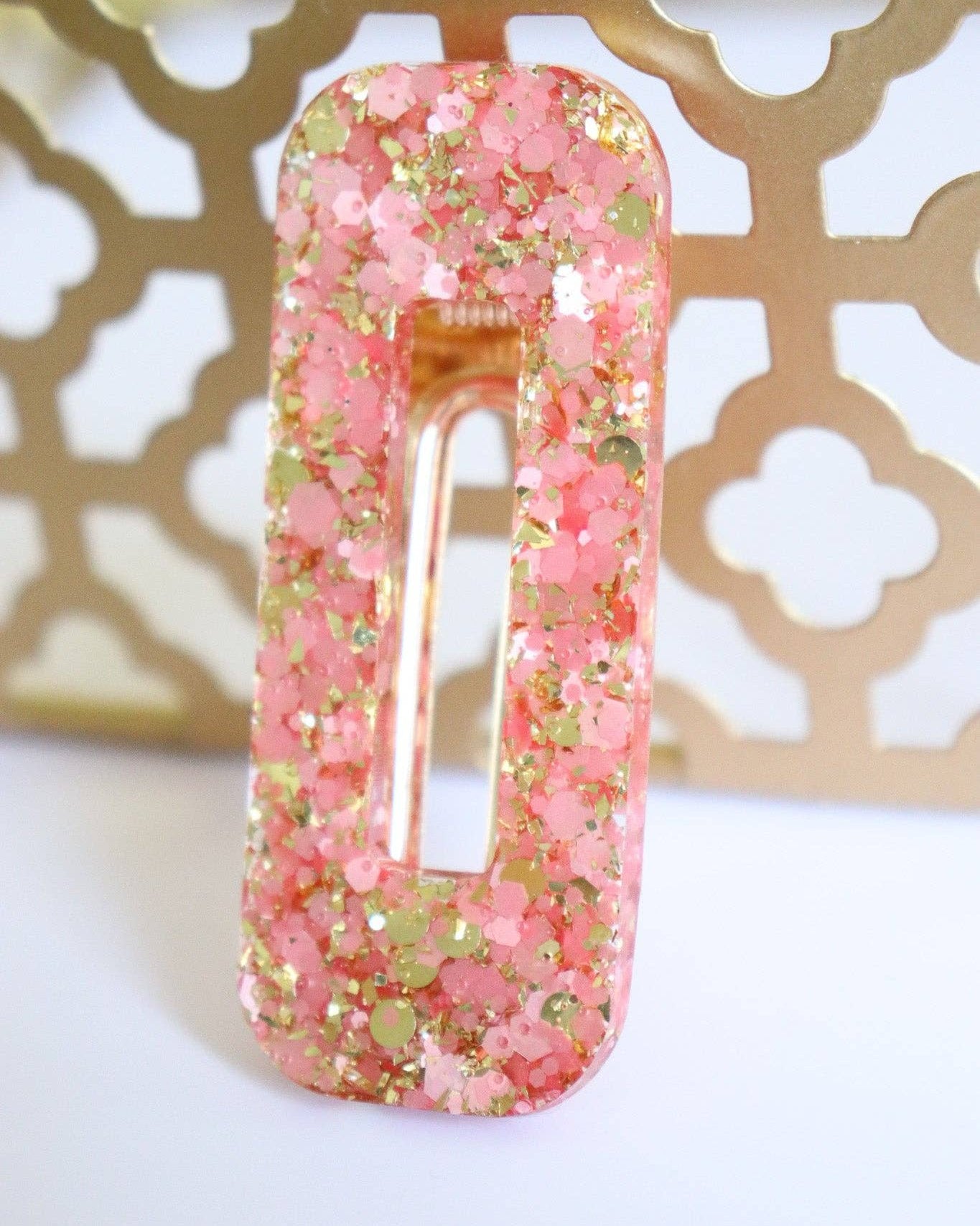 Barrette résine à paillettes rose et or